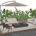 Outdoor Sofa Set With Fire Pit Umbrella And Green Plants On Wooden Deck