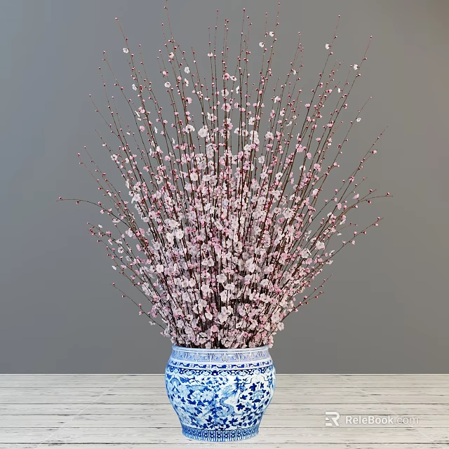 Blue and White Porcelain Vase with Pink Flowering Branches on Wooden Table against Gray Wall 3d model 