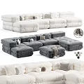 Gray And White Plush Sectional Sofa With Decorative Pillows And Throw Blanket