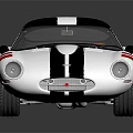 Vintage Silver Sports Car With Blue Center Stripe Red Accents Streamlined Body And Shiny Surface