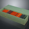 Green Wooden Storage Box With Orange And Black Chopsticks Inside
