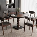 Modern Dining Space With Round Wooden Table Leather Chairs Vase Books And Potted Plant