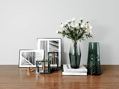 White Flowers in Green Glass Vases with Picture Frames and Books on Wooden Table 3d model