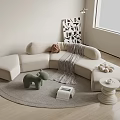 Cozy Beige Sectional Sofa in Living Room with Round Rug Throw Blanket and Plush Toys
