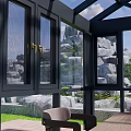 Outdoor Garden Patio Space With Black Glass Pavilion White Umbrella And Green Trees