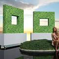 Green Plant Wall With Square Openings On White Bases By Waterfront At Sunset