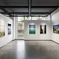 Modern Fine Arts Exhibition Hall With White Walls Large Windows And Hanging Paintings