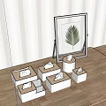Display Setup With White Cube Stands Folded Items Leaf Artwork Striped Wall And Wooden Floor