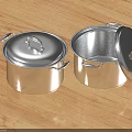 Shiny Stainless Steel Cooking Pots With Open And Closed Lids On Wooden Countertop