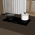Black Induction Cooktop On Kitchen Countertop With Black Handle Frying Pan And Stainless Steel Pot