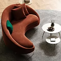 Modern Curved Orange Sectional Sofa With Green Cushion And Fireplace On Green Wall