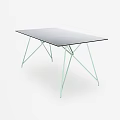 Modern Dining Table With Black Glass Top And Light Green Metal Legs
