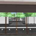 Residential Landscape View Through Glass Doors With Courtyard Water Feature Green Plants And Stone Pathway