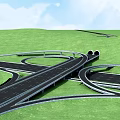 Highway Interchange Bridge with Curved Roads and Green Grassland Under Blue Sky