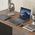 Modern Office Desk Setup With Laptop Tablet Keyboard Mouse And Headphones