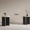 Poliform Side Tables with Black Legs Light Colored Tops Featuring Bowl Books Vase and Plant