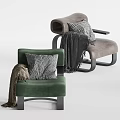 Green and Brown Leisure Chairs Featuring Knitted Pillows Cozy Blankets and Modern Metal Legs