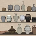 Decorative Ceramic Vessels with Various Shapes and Colors on Three Light Shelves