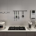 White Tiled Kitchen Countertop With Hanging Cooking Utensils Gas Stove Rice Cooker And Coffee Maker