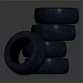 Multiple Stacked Black Rubber Tires for Automotive Vehicle Use and Storage
