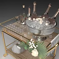 Golden Bar Cart With Champagne Bottles Wine Glasses Ice Bucket And Floral Decorations