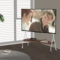 TV on Rolling Wooden Stand in Living Room With Potted Plant and Window Blinds