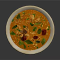 Fresh Orange Creamy Soup Topped With Green Herbs And Red Pieces In Ceramic Bowl