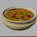 Fresh Orange Creamy Soup Topped With Green Herbs And Red Pieces In Ceramic Bowl