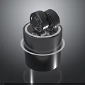 Two Car Tires Placed On A Shiny Metal Cylinder Stand Background