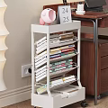 White Multi Tiered Book Shelf With Neatly Arranged Books And Magazines In Study Corner