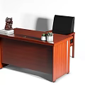 Brown Wooden Office Desk with Two Small Green Plants Sculpture Books and Black Leather Chair