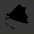 Man in Batman Costume with Large Wings Standing on Gray Background