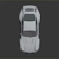 Silver Sports Car With Sleek Design Rear Spoiler Alloy Wheels And Reflective Surface