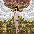 Popular Photo Spot With Giant White Wings And Sequin Background Featuring KAI80 Logo