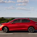 Red Honda Modern Sedan With Sleek Exterior Design And Black Alloy Wheels On Highway