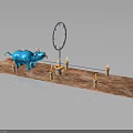 Blue Creature Monster Near Circular Ring With Lit Candles On Brown Platform