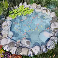 Natural Garden Water Fountain With Koi Fish Lily Pads And Surrounding Rocks