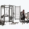 Woman Working Out With Gym Equipment Including Multi Functional Trainer And Exercise Bike