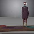 Mannequin Wearing Purple Coat Red Pants Brown Boots Red Christmas Hat With Fabrics On Table
