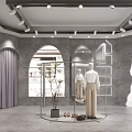 Modern Clothing Store Interior With Mannequins Clothing Racks And Decorative Plants