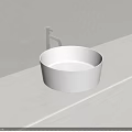 Modern Round White Washbasin on White Countertop with Silver Faucet Against Light Gray Wall