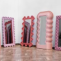 Decorative Pink Mirrors With Wavy Edges Scalloped Frames And Quilted Borders On Wooden Floor