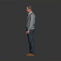 Man Standing In Gray Background Wearing Gray Cardigan White Shirt Blue Jeans And Brown Shoes
