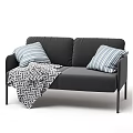 Modern Black Two Seater Sofa With Blue White Striped Pillows And Black White Geometric Blanket
