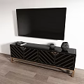 Modern Black TV Stand With Geometric Pattern Doors Gold Legs And TV On Top