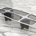 Modern Conference Table With Glass Top And Black Supporting Legs On Marble Floor