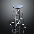 Modern Bar Stool With Speckled Round Seat And Chrome Metal Frame In Reflective Setting
