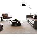 Modern Gray Leather Sofa and Coffee Table Set With Round Glass Top And Green Plant