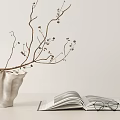 Open Magazine With Eyeglasses On Pages And Decorative White Vase In Minimalist Setting