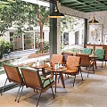 K Cafe Interior Featuring Brick Wall Wooden Panel Green Chairs Brown Bench And Large Plant